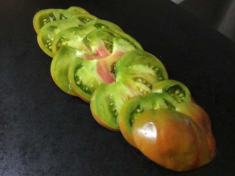 Paul Robeson heirloom tomato. Do not get between these and a duck or you will be trampled.